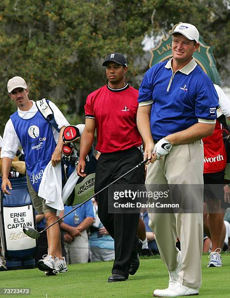 Ernie Els of South Africa drives watched by Tiger Woods of the USA at the par 4, 1st hole during the second day of the 2007 Tavistock Cup held at the...