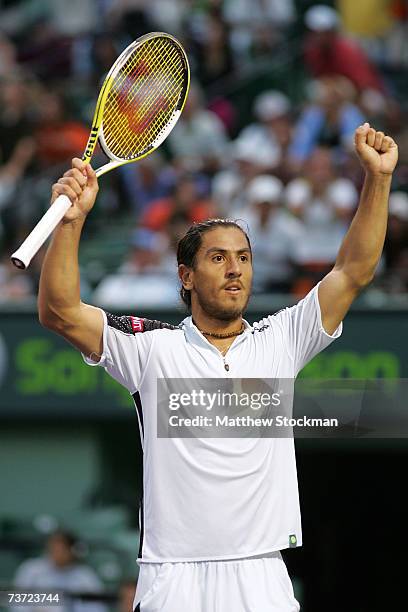 Guillermo Canas of Argentina reacts after defeating Roger Federer of Switzerland during day seven at the 2007 Sony Ericsson Open at the Tennis Center...