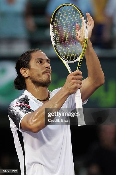 Guillermo Canas of Argentina reacts after defeating Roger Federer of Switzerland during day seven at the 2007 Sony Ericsson Open at the Tennis Center...