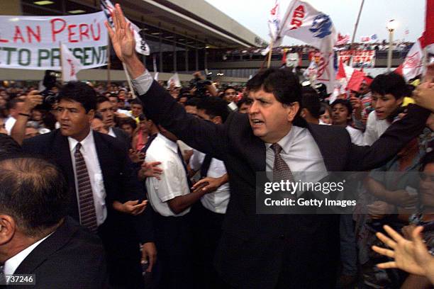 Former President Alan Garcia waves to his supporters after arriving at the Jorge Chavez airport January 28, 2001 in Lima, Peru. Garcia the populist...
