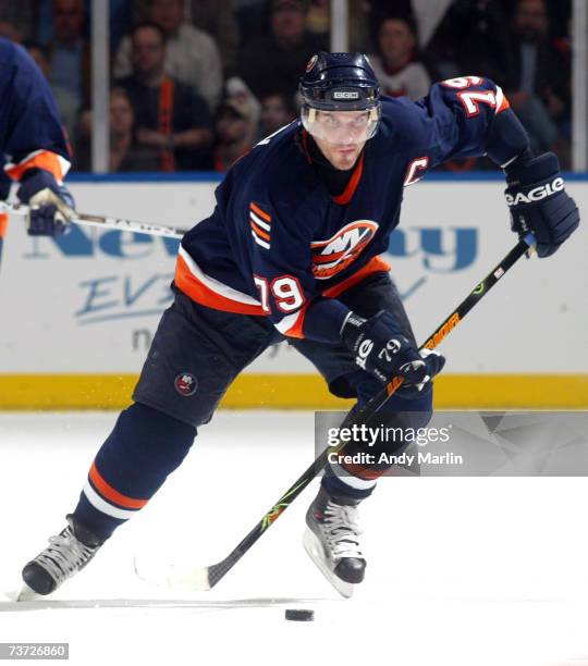 Alexei Yashin of the New York Islanders skates with the puck against the New Jersey Devils during their game at the Nassau Coliseum on March 27, 2007...