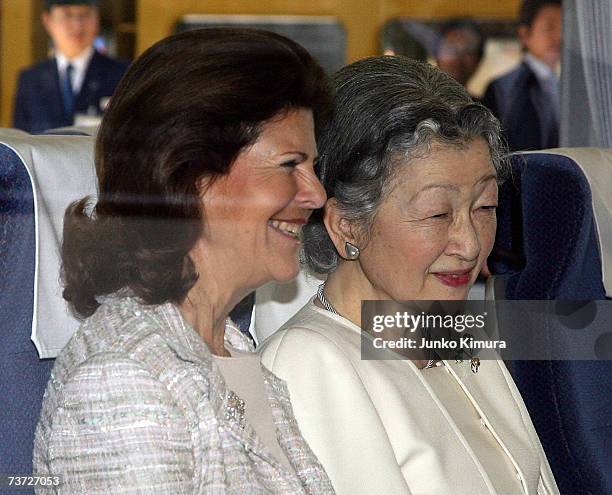 Japanese Empress Michiko and Swedish Queen Silvia smile on the train at Seibu Railway Shinjuku Station on March 28, 2007 in Tokyo, Japan. The Swedish...