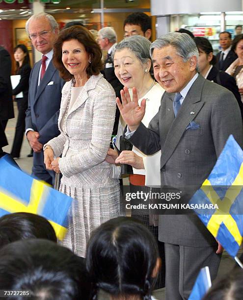 Japanese Emperor Akihito , Empress Michiko , Sweden's Queen Silvia and King Carl XVI Gustav are welcomed by kindergarden children on their arrival at...