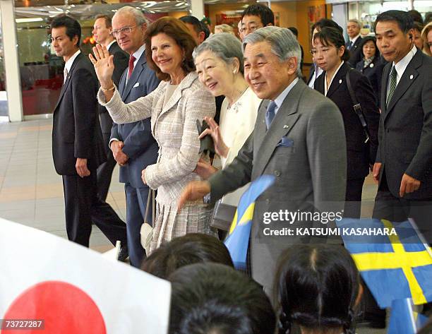 Japanese Emperor Akihito , Empress Michiko , Sweden's Queen Silvia and King Carl XVI Gustav are welcomed by kindergarden children on their arrival at...