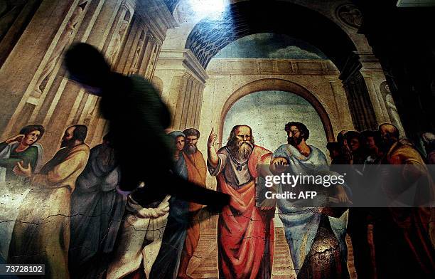 Picture taken 23 March 2007 shows a Bulgarian student passes along a copy of the fresco originally named "School of Athens", and originally painted...