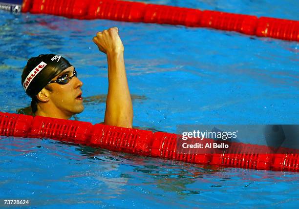 Michael Phelps of the USA celebrates his win and new world record in the Men's 200m Butterfly Final during the XII FINA World Championships at the...