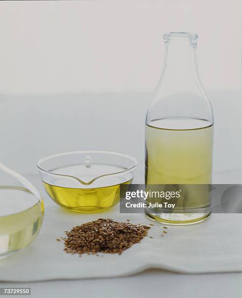 "flax seed oil and flax seeds, close-up" - flax seed stock pictures, royalty-free photos & images