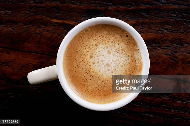 "espresso coffee on table, overhead view" - cappuccino top view stock-fotos und bilder