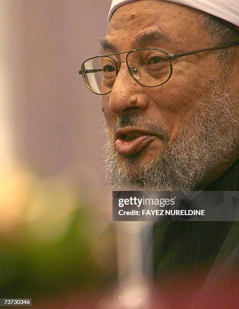 Qatar's Egyptian-born cleric Sheikh Yusuf al-Qaradawi smiles during a press conference held on the eve of the fifth International Al-Quds conference,...