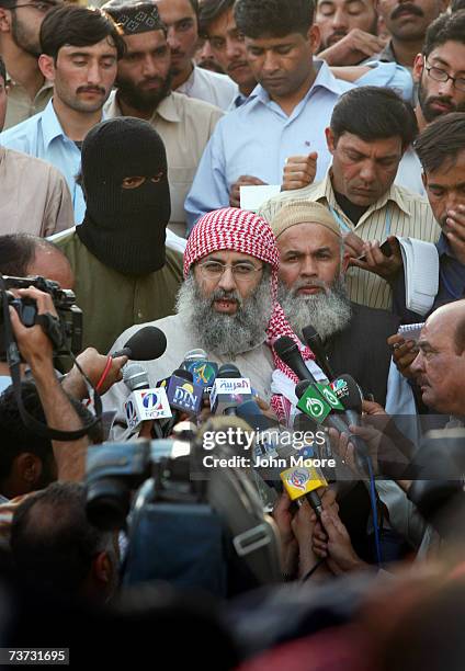 Islamic cleric Abdul Rashid Ghazi holds a news conference at the Lal Mosque madrassa where students are holding three women and two policemen hostage...