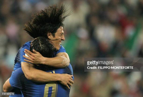Italy's Luca Toni is embraced by teammate Mauro Camoranesi after scoring his second goal against Scotland during their Euro 2008 Group B qualifying...