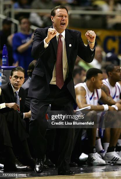 Head coach Bill Self of the Kansas Jayhawks cheers on his team against the Southern Illinois Salukis during round three of the NCAA Men's Basketball...