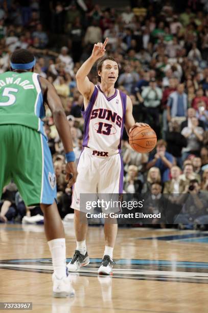 Steve Nash of the Phoenix Suns sets the play against the Dallas Mavericks at American Airlines Center on March 14, 2007 in Dallas, Texas. The Suns...