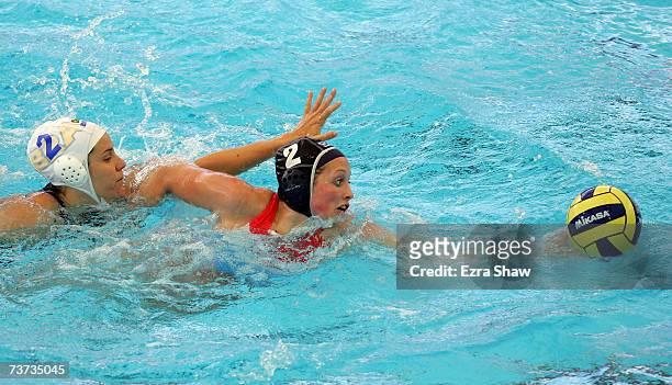 Ana Carolina Vasconcelos of Brazil battles with Yasemin Smit of Netherlands in the Women's Final Round 9th-10th place Water Polo match between Brazil...