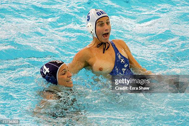 Kyriaki Liosi of Greece has her swimsuit torn by by Silvia Bosurgi of Italy in the Women's Final Round Water Polo match between Greece and Italy at...