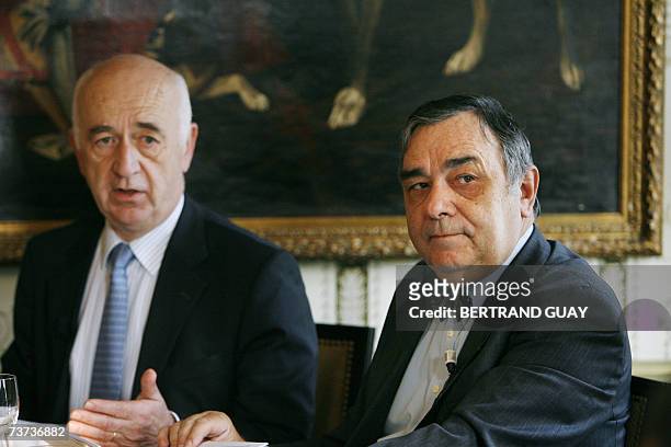 French oil company Maurel and Prom chairman of the managing board Jean-Francois Henin talks as Managing Director Roman Gozalo listens during a press...