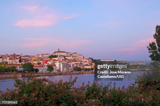 coimbra, old town and mondego river at dusk, beira litoral, portugal - mondego stock pictures, royalty-free photos & images