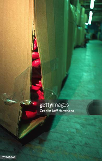 Plastic pink flamingo peaks over the edge of a cardboard box as the originial plastic pink flamingo is manufactured by Union Products on March 18,...