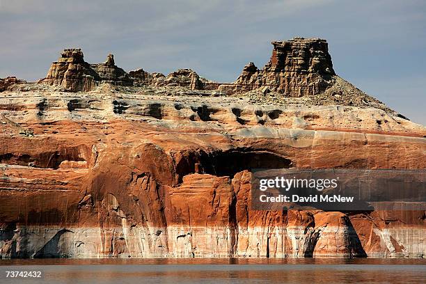 Bleached "bathtub ring", the result of a six-year drought that has dramatically dropped the level of the reservoir, shows on red Navajo sandstone...