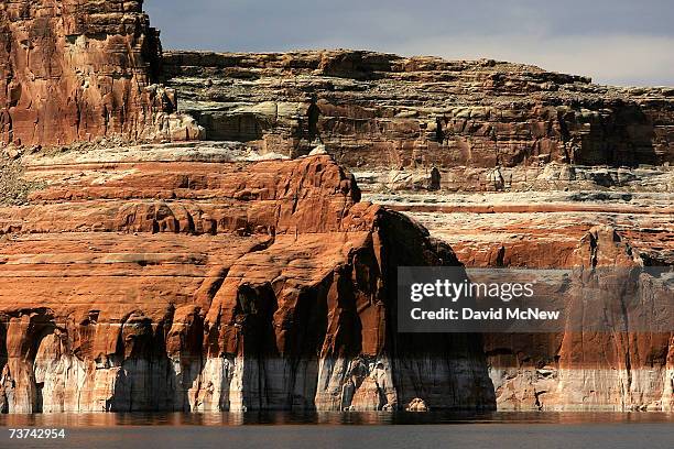 Bleached "bathtub ring", the result of a six-year drought that has dramatically dropped the level of the reservoir, shows on red Navajo sandstone...