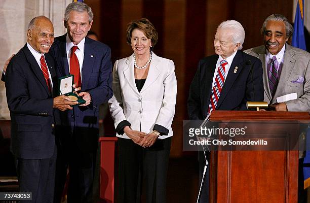 Tuskegee Airman Dr. Roscoe Brown is presented with the Congressional Gold Medal by President Bush, House Speaker Nancy Pelosi , Sen. Robert Byrd and...