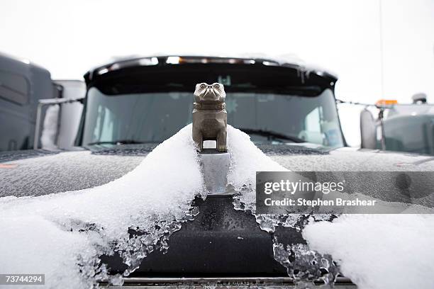 The Mack Truck bulldog sits atop a snow-covered grill of a semi-truck stuck at the Broadway Fuel Stop March 29, 2007 in Hardin, Montana. A spring...