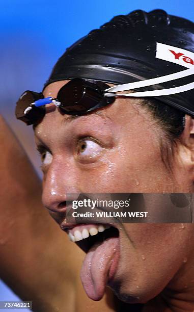 Caption correction. Flavia Rigamonti of Switzerland reacts after racing in the women's 1500m freestyle final 27 March 2007 in Melbourne at the 12th...