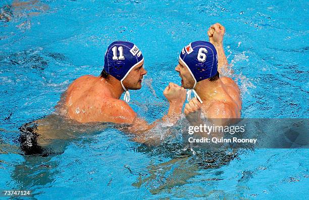 Gabor Kis and Marton Szivos of Hungary celebrate scoring a point during the Men's semi-final Water Polo match between Spain and Hungary at the...