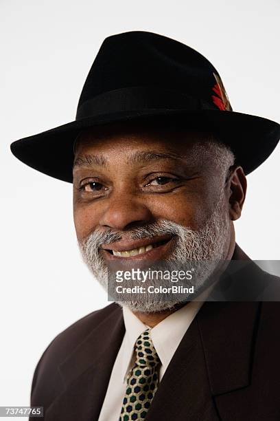 man wearing hat, smiling, portrait, close-up - blind white background stock pictures, royalty-free photos & images