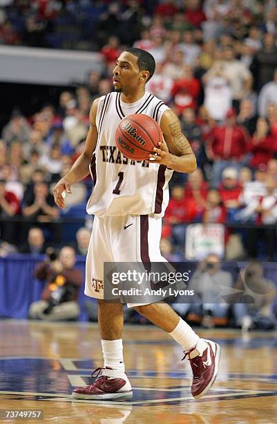 Acie Law of the Texas A&M Aggies advances the ball against the Louisville Cardinals during round two of the NCAA Men's Basketball Tournament at Rupp...