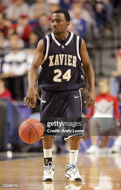 Drew Lavender of the Xavier Musketeers dribbles the ball against the Ohio State Buckeyes in round two of the NCAA Men's Basketball Tournament at Rupp...