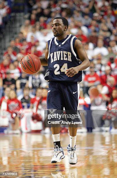 Drew Lavender of the Xavier Musketeers dribbles the ball against the Ohio State Buckeyes in round two of the NCAA Men's Basketball Tournament at Rupp...