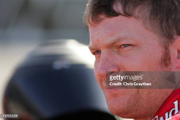 Dale Earnhardt Jr., driver of the Budweiser Chevrolet, looks on during qualifying for the NASCAR Nextel Cup Series Goody's Cool Orange 500 at...