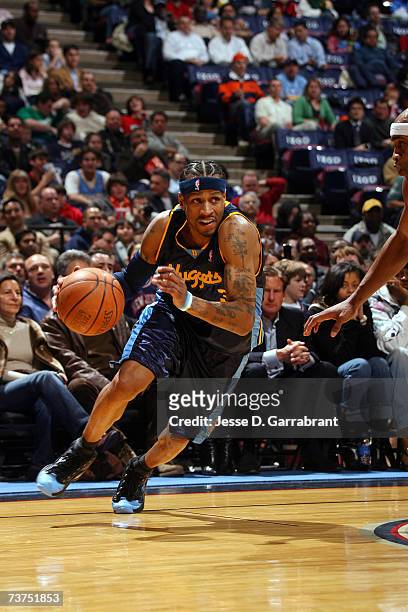 Allen Iverson of the Denver Nuggets drives from the outside during the game against the New Jersey Nets at Continental Airlines Arena on March 20,...