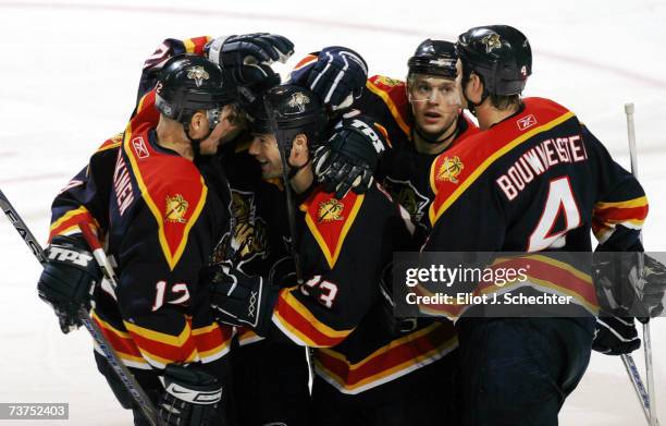 Martin Gelinas of the Florida Panthers is swarmed by teammates after scoring to tie up the game 2-2 against the Washington Capitals in the second...