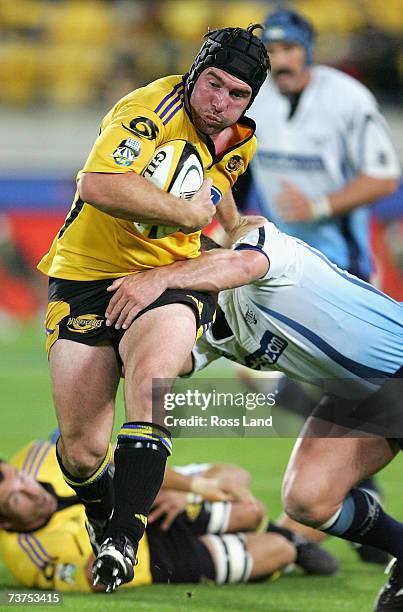 Andrew Hore of the Hurricanes runs through a Bulls defender during the round nine Super 14 match between the Hurricanes and the Bulls at Westpac...