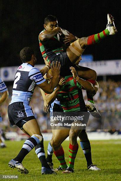 Nathan Merritt of the Rabbitohs takes a high ball during the round three NRL match between the Cronulla Sharks and the South Sydney Rabbitohs at...
