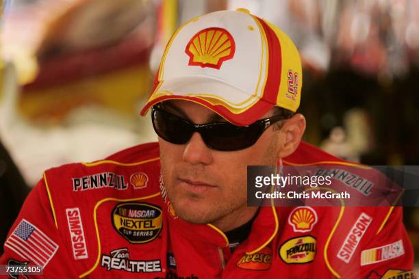 Kevin Harvick, driver of the Shell/Pennzoil Chevrolet, looks on in the garages during practice for the NASCAR Nextel Cup Series Goody's Cool Orange...