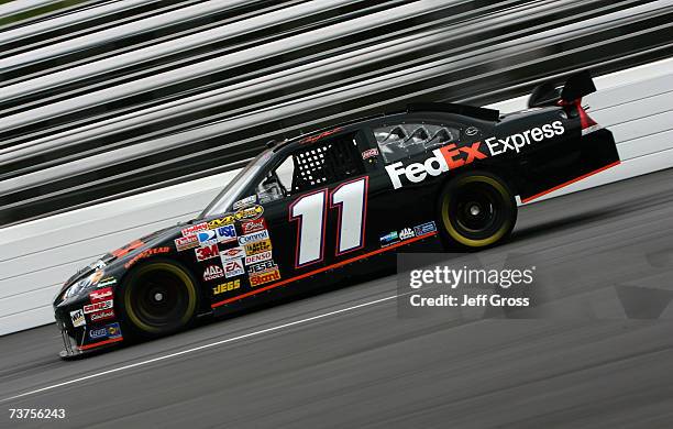 Denny Hamlin, driver of the FedEx Express Chevrolet, drives during practice for the NASCAR Nextel Cup Series Goody's Cool Orange 500 at Martinsville...