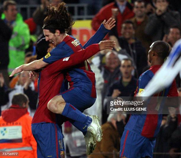 Barcelona's Argentinian Leo Messi , Brazilian Ronaldinho , Cameronian Samuel Eto'o celebrate the first goal against Deportivo during their Spanish...