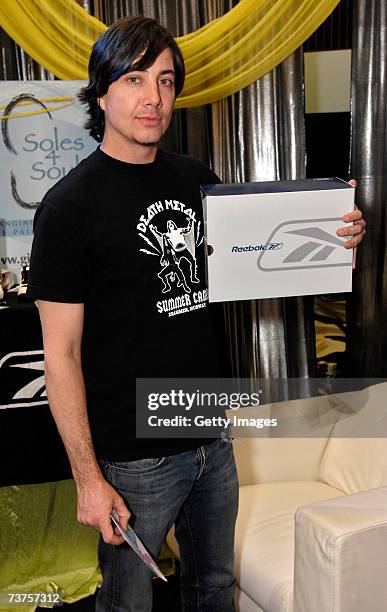 Musician Matt Flynn poses with the Reebok display in the Distinctive Assets gift lounge during the 20th annual Kid's Choice Awards at Pauley Pavilion...