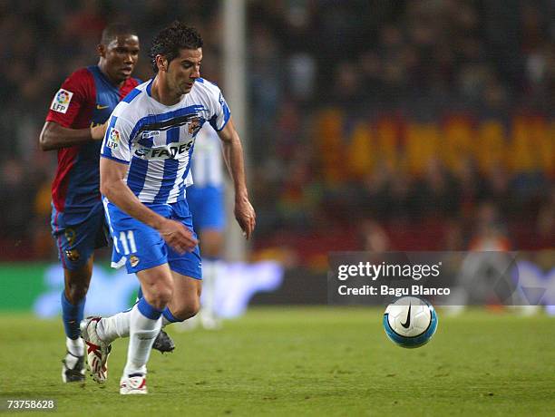 Riki of Deportivo and Samuel Etoo compete during the match between FC Barcelona and Deportivo La Coruna of La Liga at the Camp Nou stadium on March...