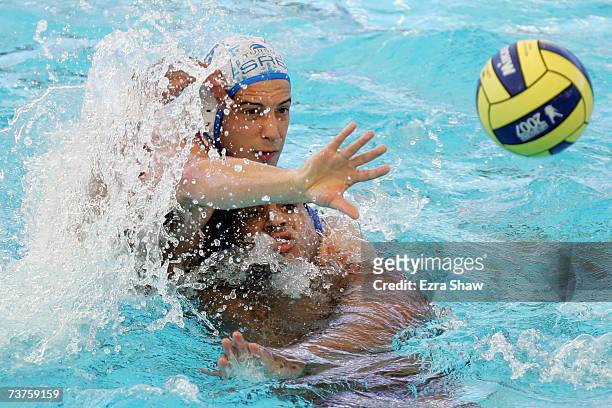 Vanja Udovicic of Serbia battles with Ivan Perez of Spain in the Men's Bronze medal Water Polo match between Serbia and Spain at the Melbourne Sports...