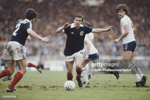 Scottish professional footballer and winger with Nottingham Forest, John Robertson pictured in action for the Scotland national football team making...