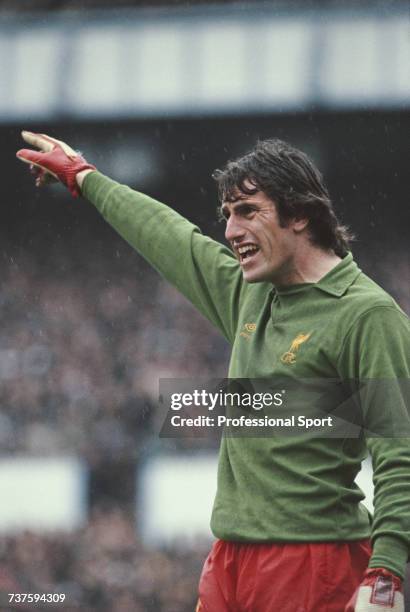 English professional footballer and goalkeeper with Liverpool, Ray Clemence pictured in goal during a rain soaked first division match circa 1979.