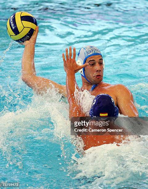 Vanja Udovicic of Serbia looks to pass the ball around David Martin of Spain during the Men's Bronze medal Water Polo match between Serbia and Spain...