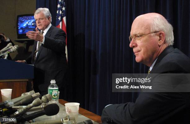 Senator Edward Kennedy , left, answers questions from reporters as Senator Patrick Leahy looks on as they respond to the Senate confirmation of John...