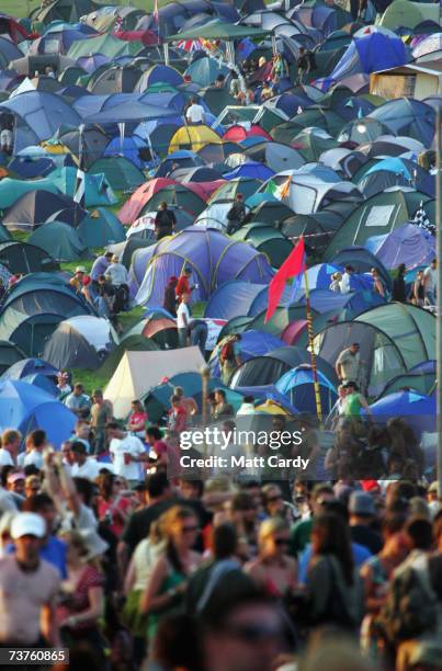 Tents and festival-goers are seen on the third and final day of the Glastonbury Music Festival 2005 at Worthy Farm, Pilton on June 26, 2005 in...