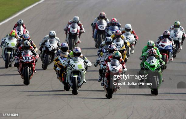 Troy Bayliss of Australia and Ducati Xerox Team leads James Toseland of Great Britain and Hanspree Ten Kate Honda at the start of the first race...