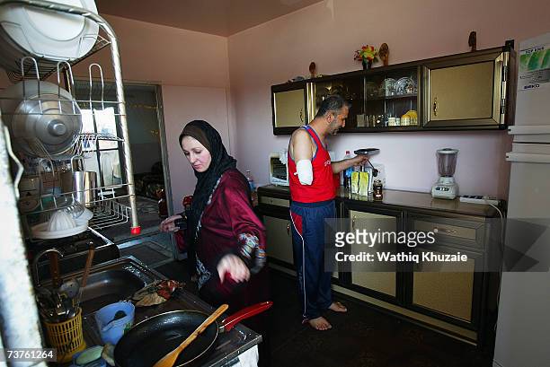 Fuad Mosa Muhammad, age 40, makes coffee as his wife works in their kitchen on March 28, 2007 in Baghdad, Iraq. Fuad, a cook at a breakfast and lunch...